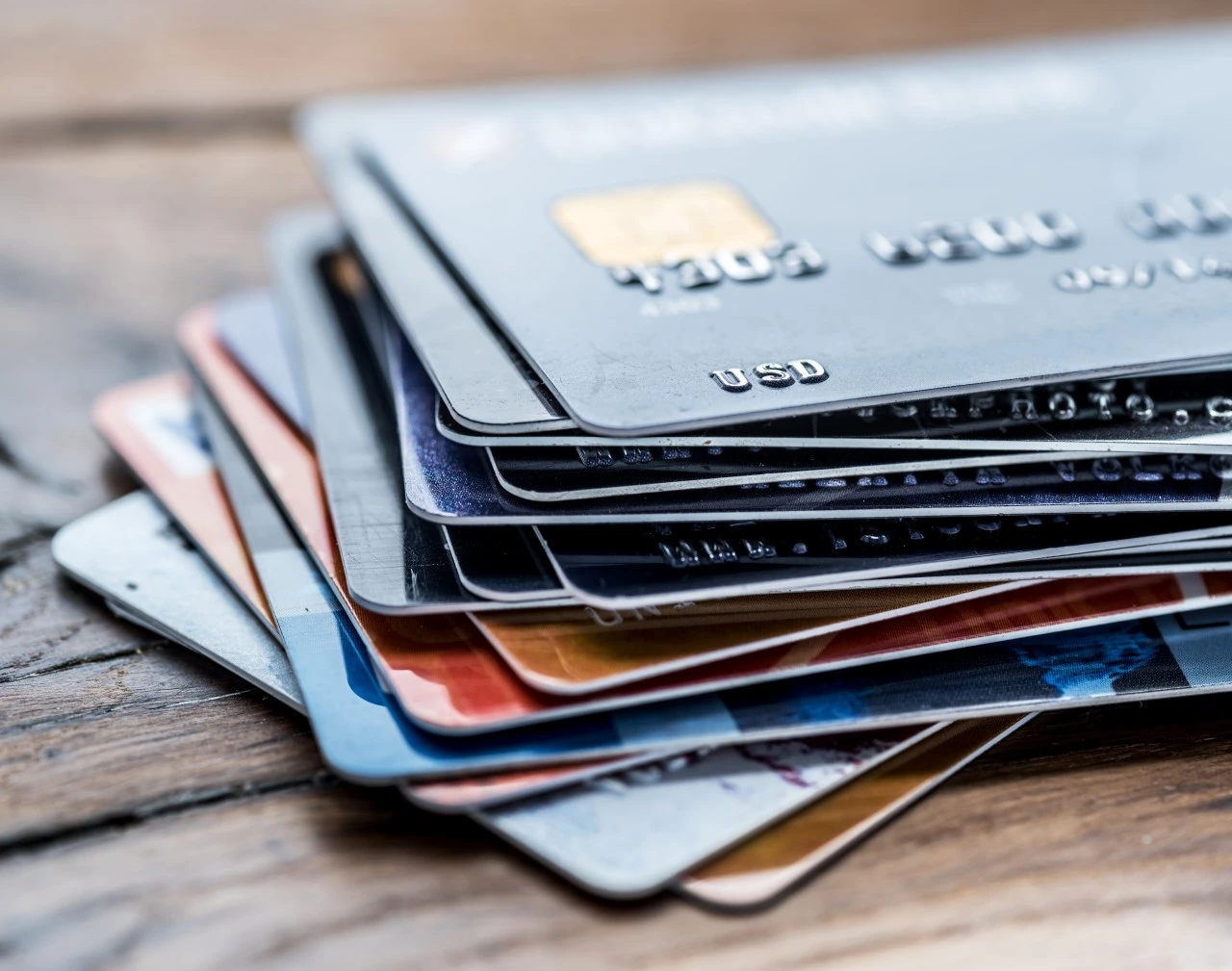 A stack of credit cards resting on a surface, highlighting options used when applying for a CPN Apartment.